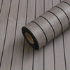 Roll of extra thick 3D wood grain self-adhesive wallpaper with black markings on a wooden surface.