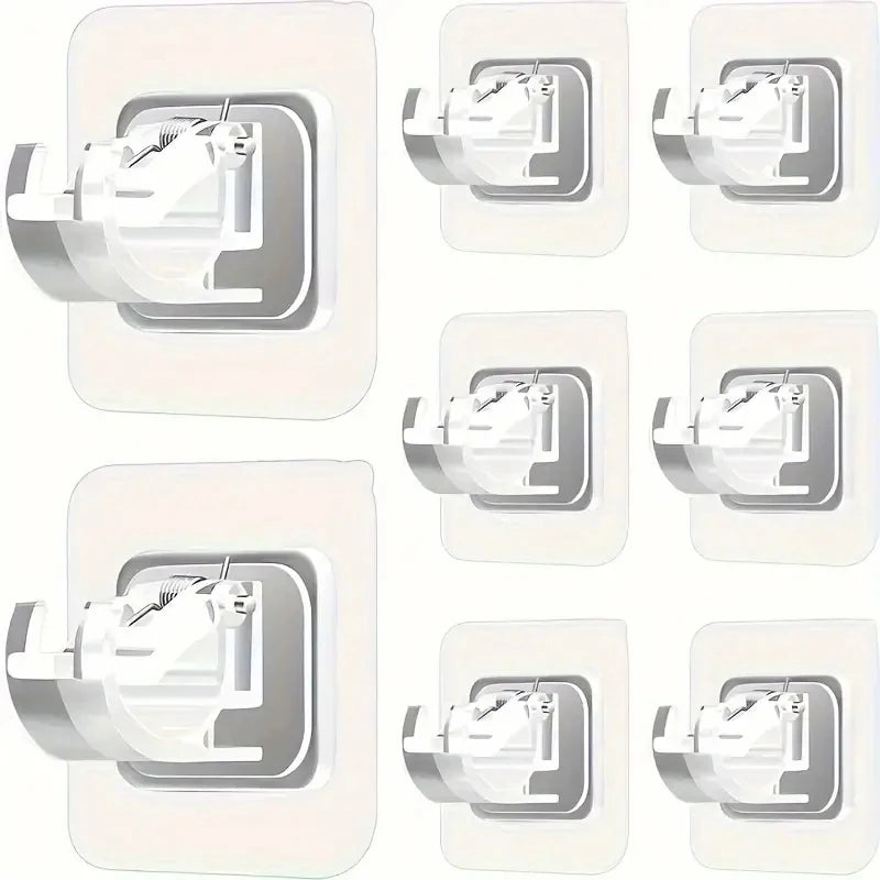 Multiple views of adhesive curtain rod hooks used for no-drill wall mounting clips.