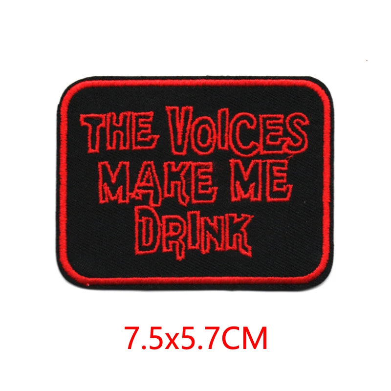 Black embroidered iron-on letter patch with red text that reads The Voices Make Me Drink