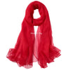 A vibrant red silk scarf draped elegantly.
