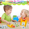 A child is playing with yellow flash cards and toys for learning English and Spanish sight words.