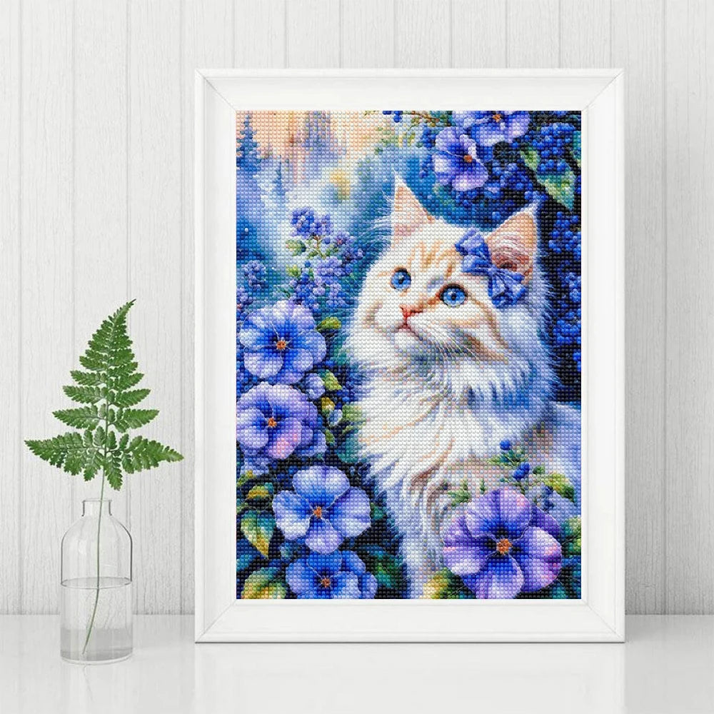A diamond painting of a fluffy white and blue cat surrounded by purple and blue flowers.