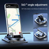 A smartphone is mounted on an anti-slip dashboard mount, demonstrating 360 degree angle adjustment.