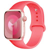 A pink silicone sport band for an Apple Watch shown on a white background.