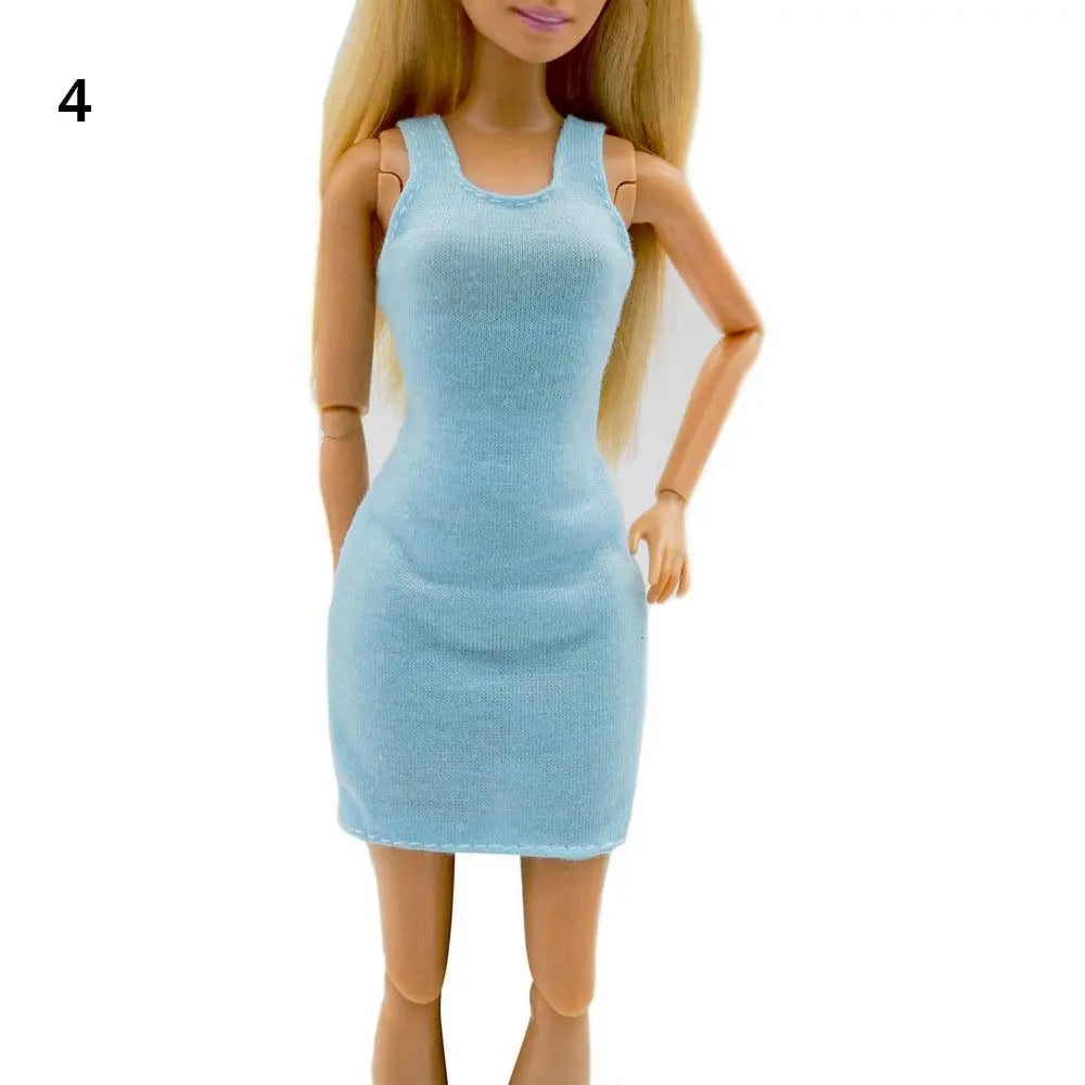 A fashion doll wearing a light blue, fitted mini dress with a scoop neckline and short sleeves.