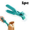A teal silicone bowl and plate gripper clip is shown being used to hold food in a wooden bowl.