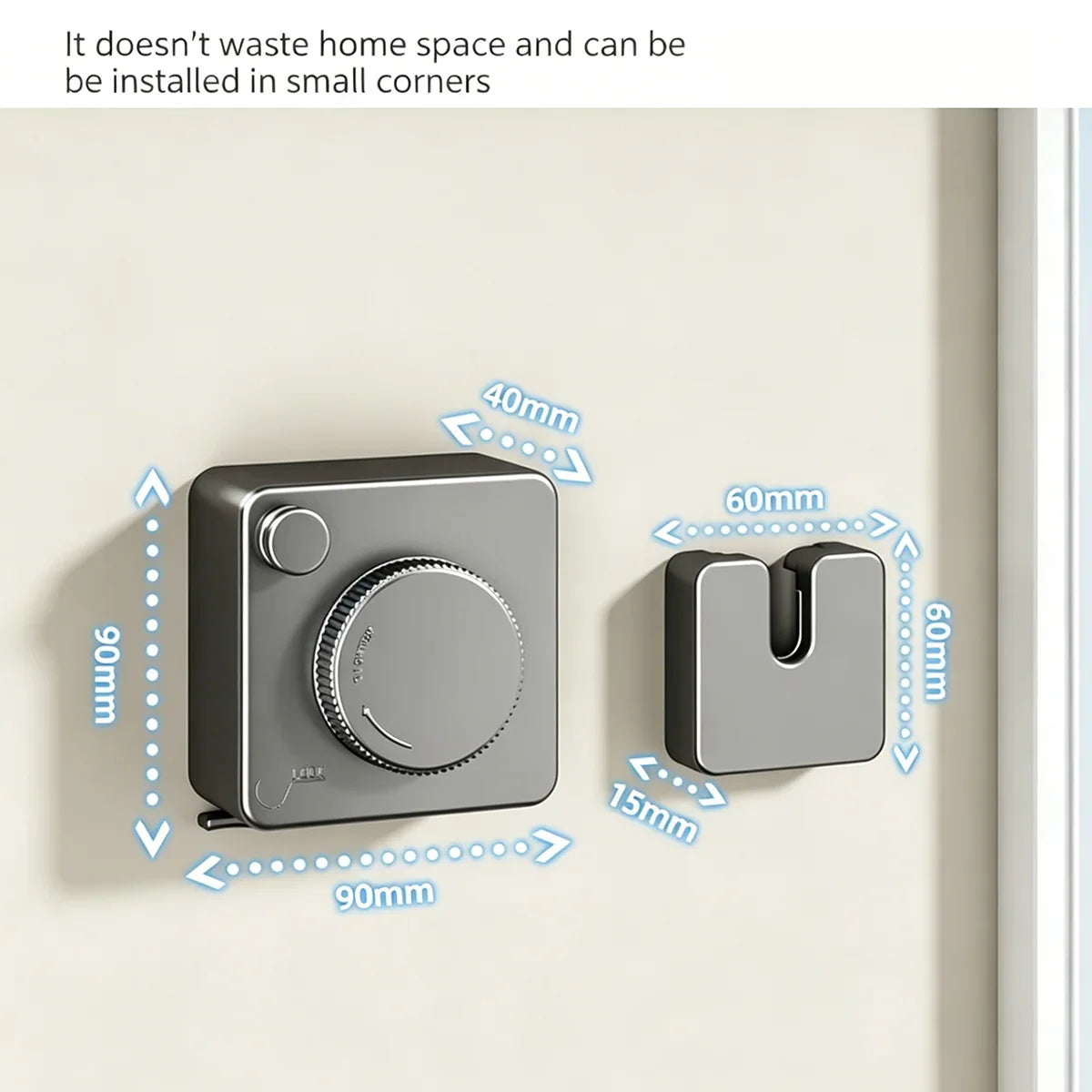 A gray retractable clothesline with a round knob is installed on a light-colored wall.