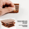 A hand is holding and separating strips of tire repair material made of butyl rubber and natural rubber vulcanization.