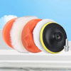 A set of six orange and white car polishing pads with a black drill adapter shown on a white surface.