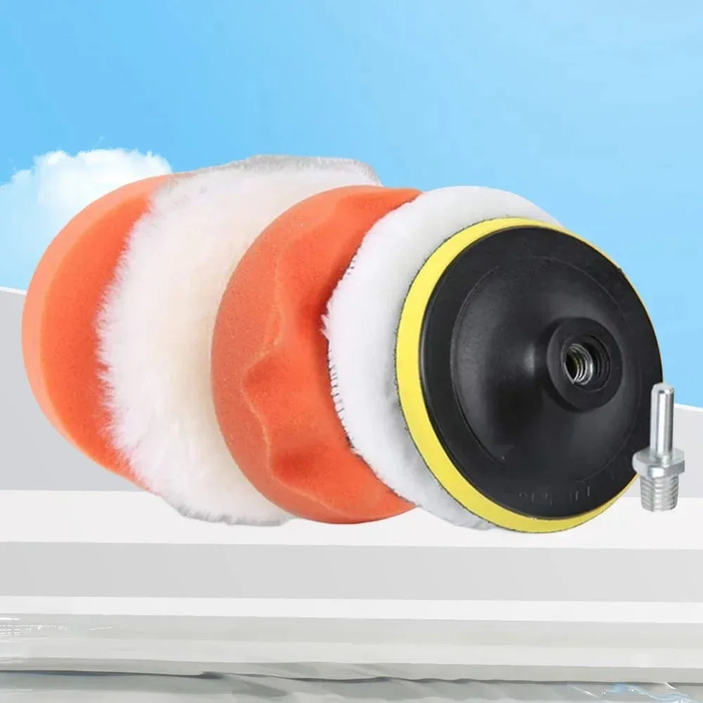 A set of six orange and white car polishing pads with a black drill adapter shown on a white surface.