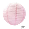 A round pink paper lantern with vertical folds.