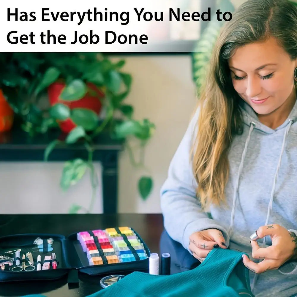 A woman is looking down at a portable sewing kit with various tools laid out on a dark surface.
