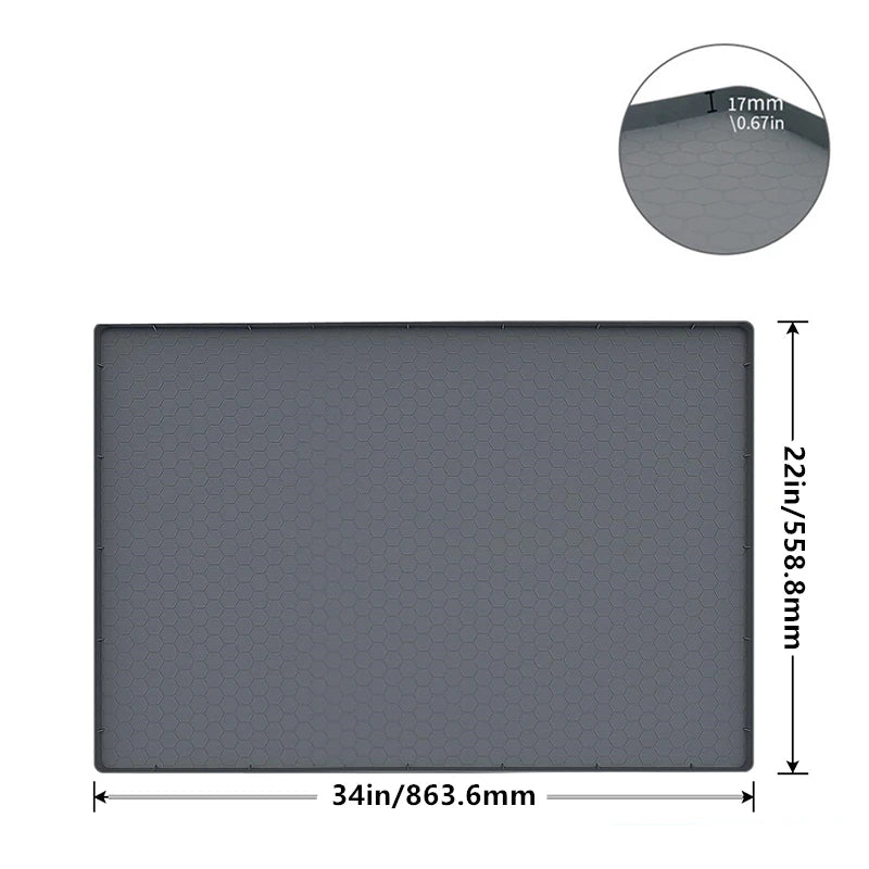 A rectangular gray silicone mat for under-sink use with a raised edge and dimensions of 34in x 22in.