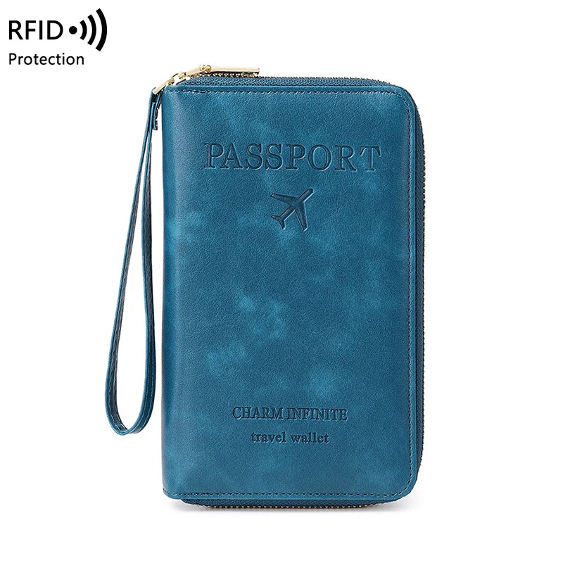 A dark teal passport wallet with a zipper and wrist strap, featuring the text 'PASSPORT' and 'CHARM INFINITE travel wallet'.