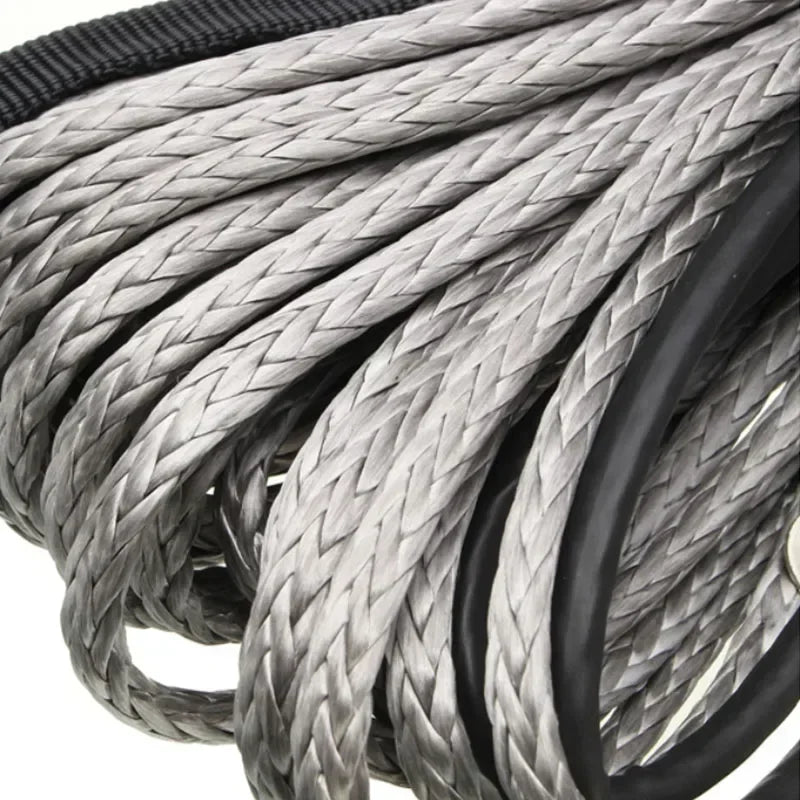 Close-up of a thick, gray braided synthetic winch rope coiled within a black protective sheath.