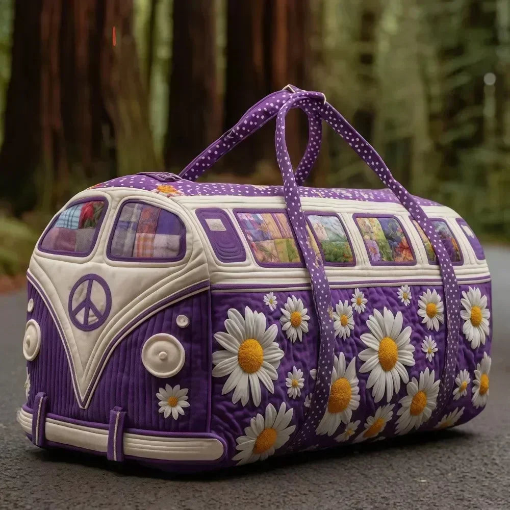 Purple quilted travel duffle bag with white daisy stitching set against a forest background