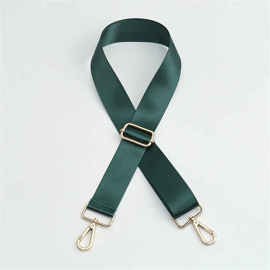 A dark green nylon bag strap with a gold buckle and metal clasps.