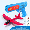 A blue catapult gun and a red foam airplane are shown together.