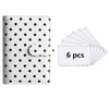 A6 polka dot PU leather binder wallet with cash envelopes and card holder shown next to a stack of six white cards.