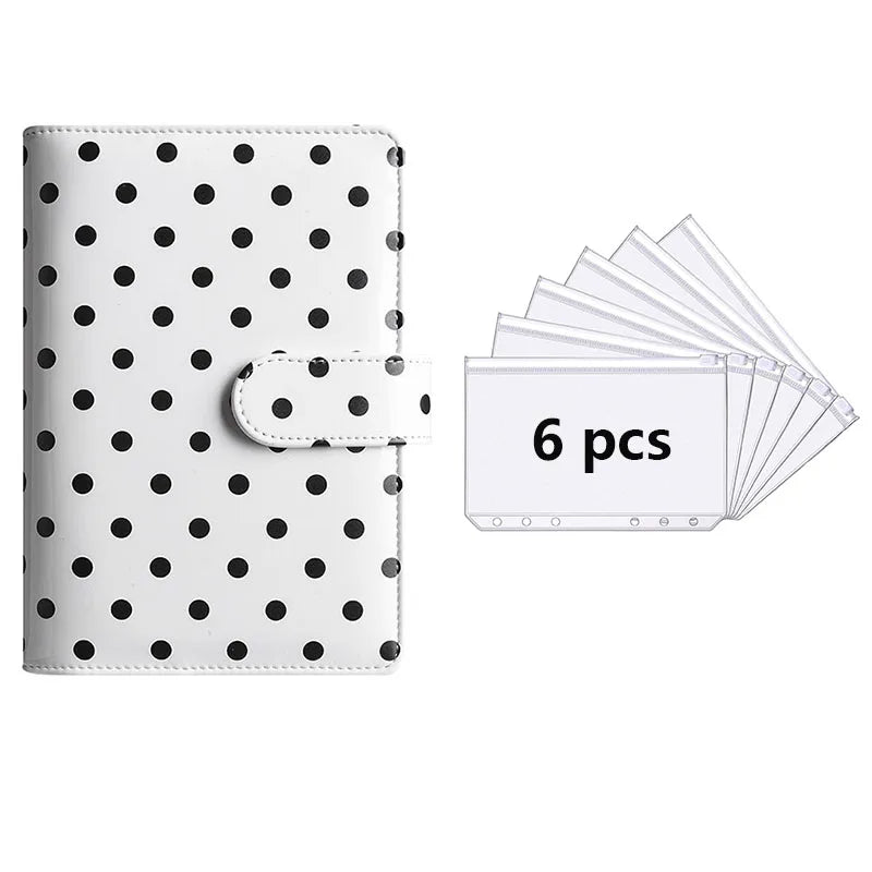 A6 polka dot PU leather binder wallet with cash envelopes and card holder shown next to a stack of six white cards.