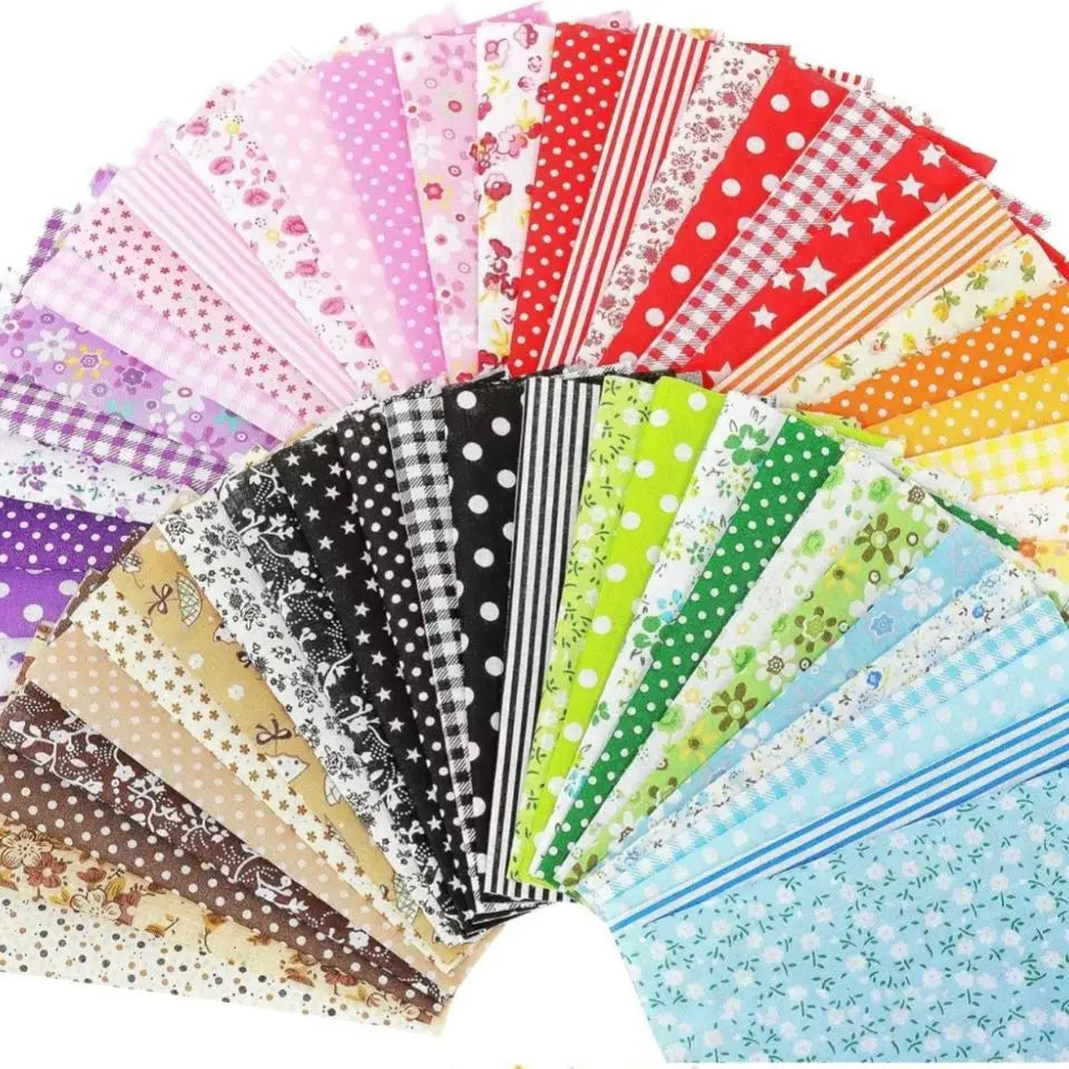 A colorful bundle of cotton fabric squares featuring various patterns including floral dots, stripes, and polka dots.