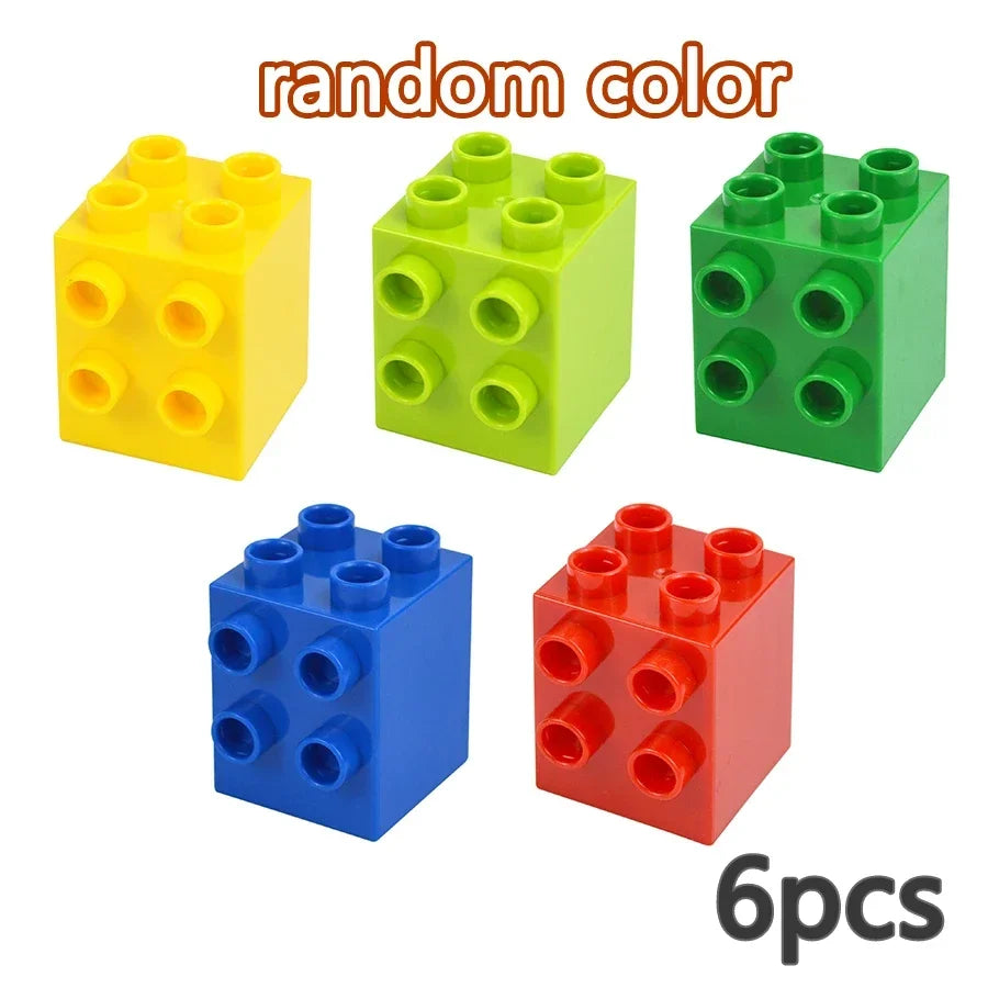 A set of six random colored building blocks in yellow, green, and red.
