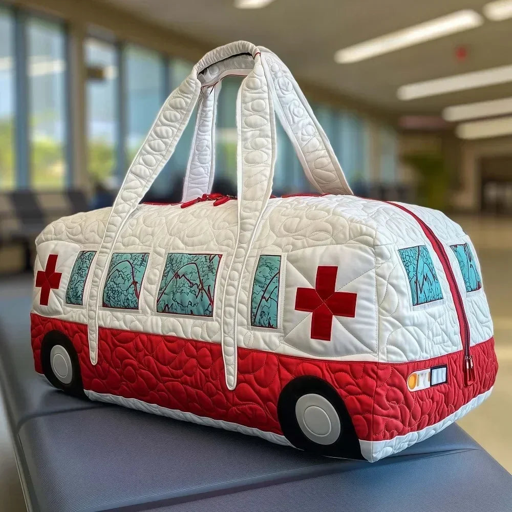 A white quilted travel duffle bag with red accents and white straps resting on a gray surface.