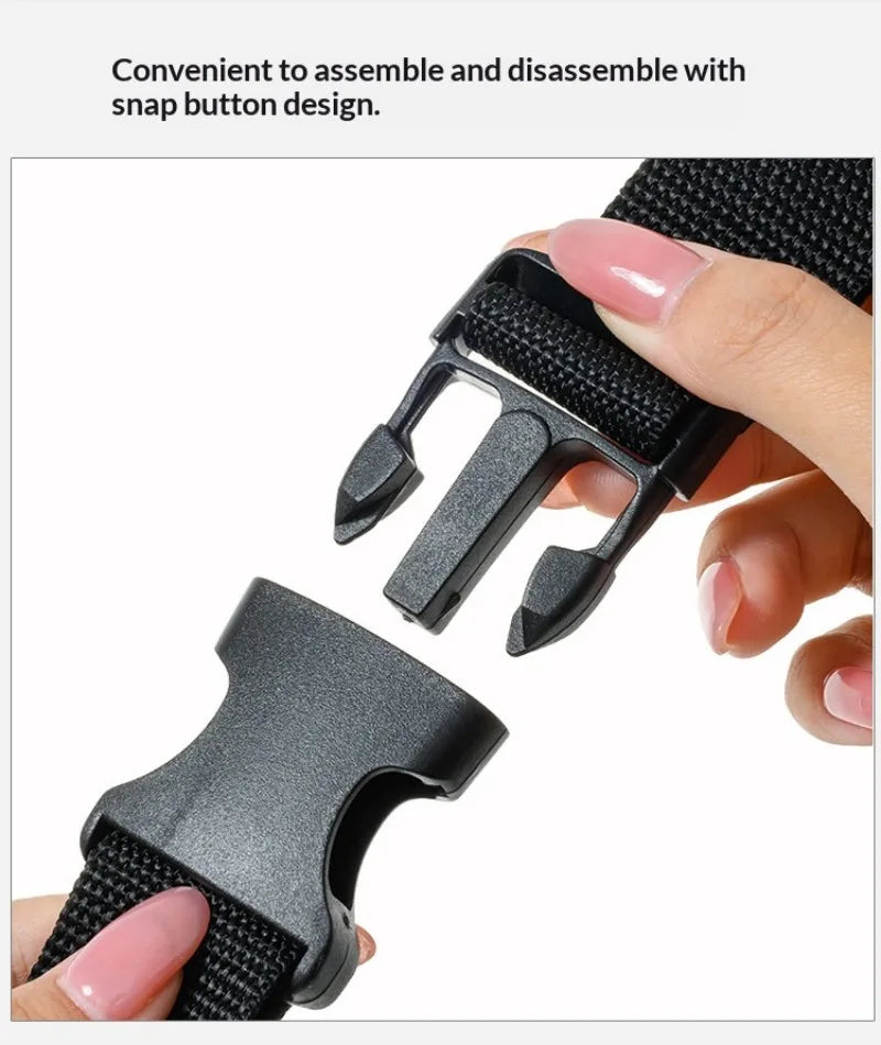 A hand demonstrates the convenient snap button design of a black adjustable travel luggage strap and belt.