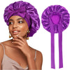 A woman wearing a purple satin sleeping bonnet with an adjustable tie.