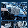 A hand using an ultra-soft microfiber wheel cleaning brush and glove to remove stains from a car's surface.