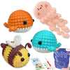 A set of beginner crochet amigurumi animals including an orange fish, a pink starfish, and a blue sea creature.