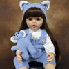 A lifelike silicone baby doll with blue ears and a matching blue knitted outfit.