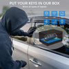 A hand puts a key fob into a black carbon fiber box inside a car, blocking various signals.