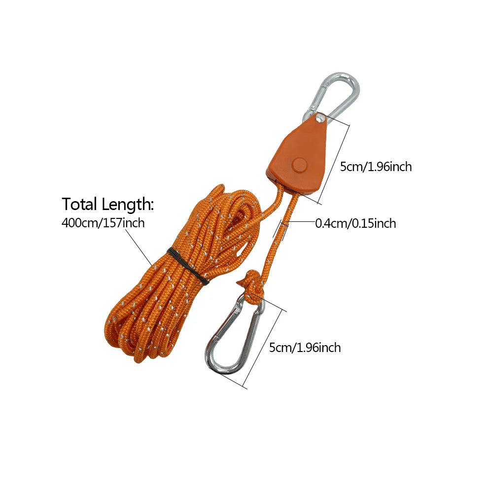 Orange camping rope tensioners with pulley buckles and various lengths of cord