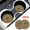 Two absorbent leather car cup holder mats with a star pattern and gauge markings are shown inside a car cup holder.