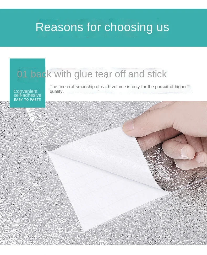 A hand is applying a white, self-adhesive sticker to a textured surface, demonstrating its ease of use.