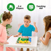 A boy and a girl play a wooden dice game on a table with colorful wooden pieces.