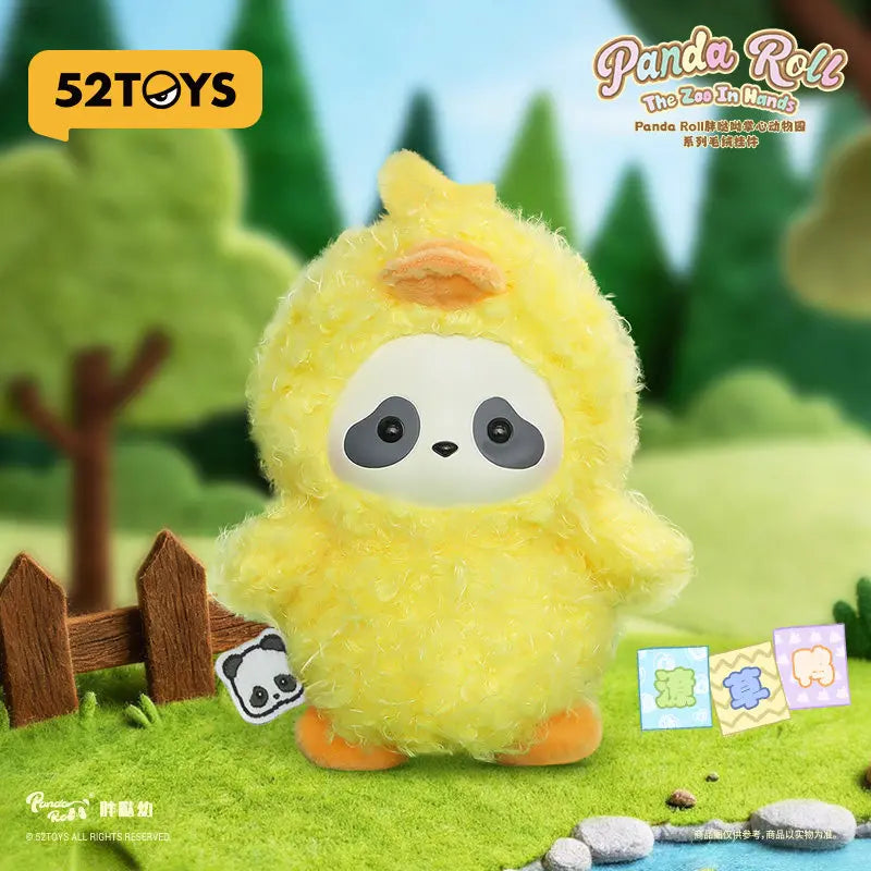 A yellow panda plush toy with large eyes is shown in a natural outdoor setting.