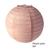 A round paper lantern in a soft peach powder color with vertical pleats.