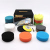 A set of car headlight restoration products including a box, sanding discs, and polishing pads in various colors.