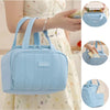 A light blue quilted insulated lunch tote bag is shown being held by a woman, with close-ups of the bag and its interior.