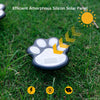An efficient amorphous silicon solar panel shaped like a dog paw, placed on green grass with a sun icon.
