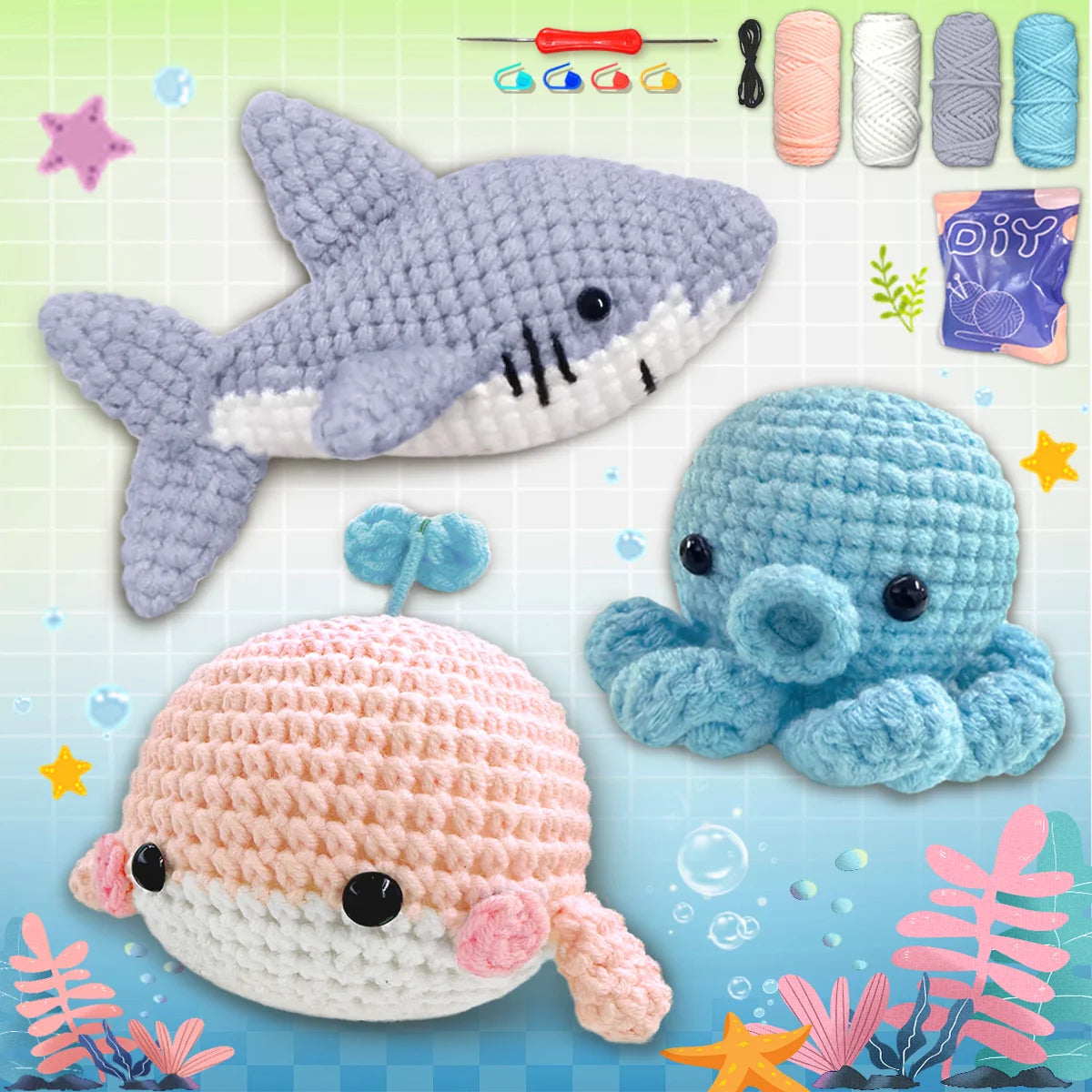 A collection of crocheted animal amigurumi toys including a shark, a blue elephant, and a pink and white sea creature.