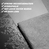 A close-up of a dark liquid being wiped by a gray microfiber cloth, highlighting its strong decontamination and streak-free p