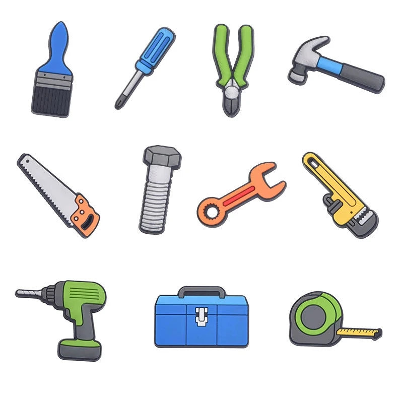 A collection of various tools and craft items including a paint brush, pins, a hammer, a screwdriver, a knife, a wrench, and 