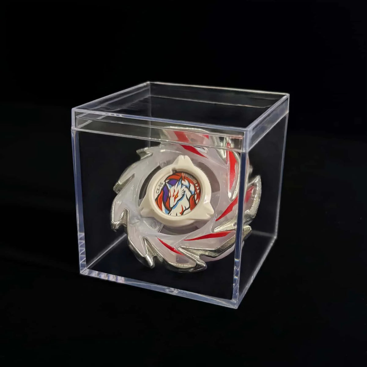A Valkyrie Volt S4-70V metal spinning top with launcher displayed inside a clear plastic box.