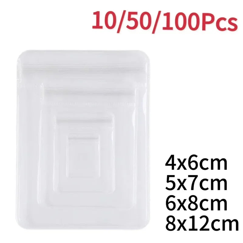 Clear self-sealing jewelry storage bags in various sizes including 4x6cm, 5x7cm, 6x8cm, and 8x12cm