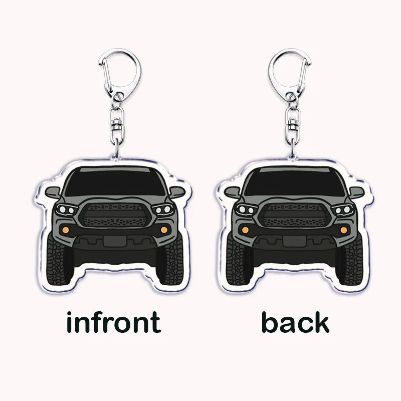A pair of durable metal key rings featuring silver clasps and silhouette charms of an off-road truck's front and back views.