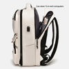A white and black travel backpack designed to store 15.6-inch computers.