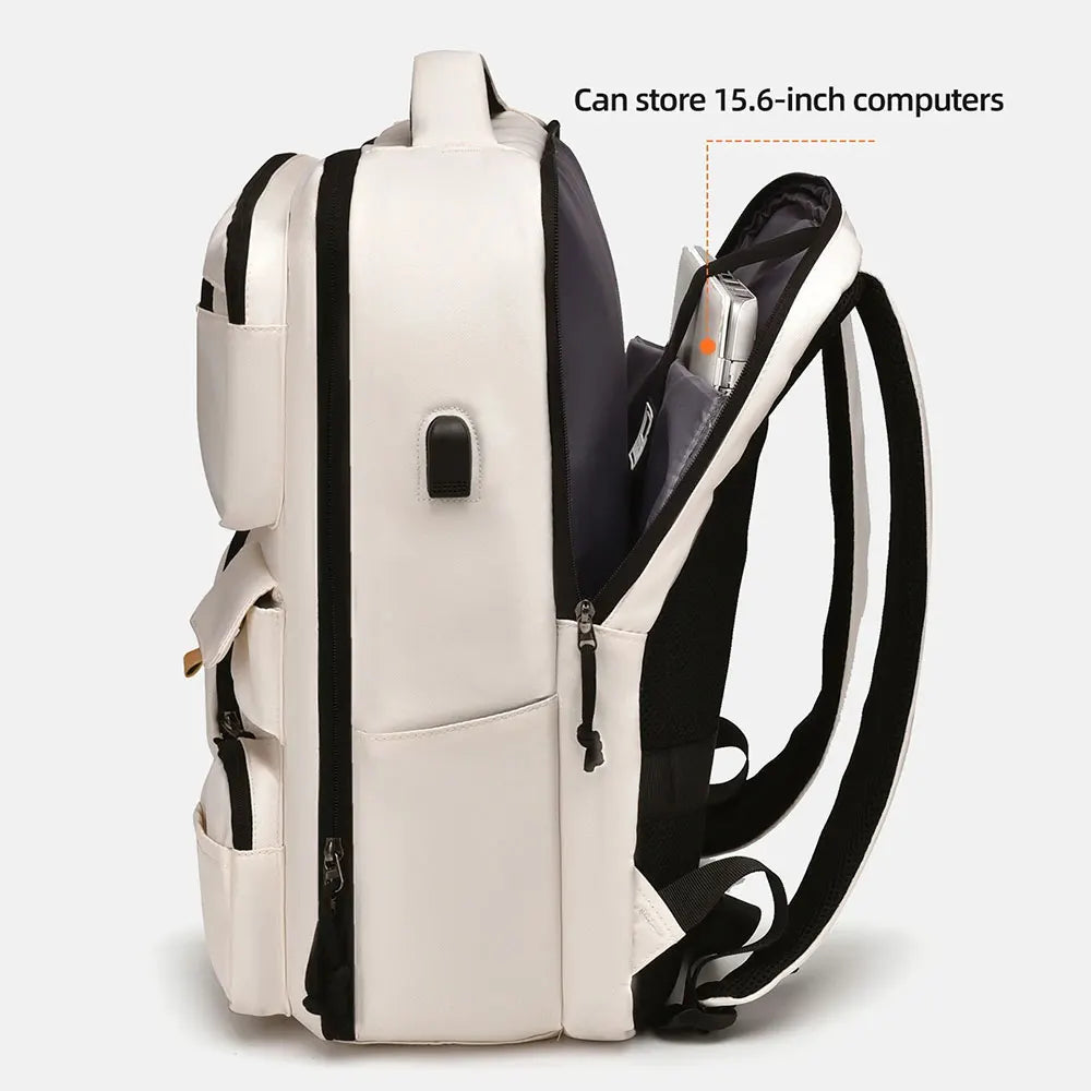 A white and black travel backpack designed to store 15.6-inch computers.